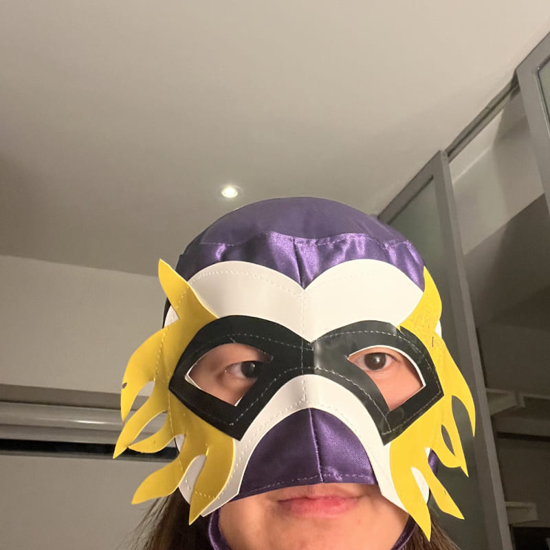 a selfie of a woman with a lucha mask on