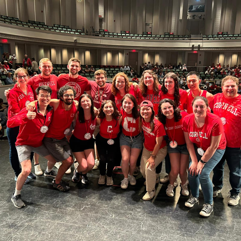 A large group of people wearing their Cornell University gear