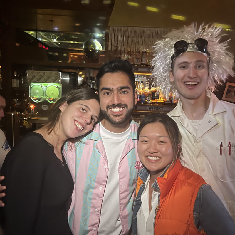 Cindy and Ian dressed as Marty McFly and Doc with Nikhil and Grace in a bar