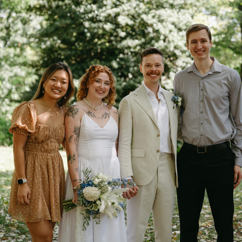 A bride, groom, and Cindy and Ian