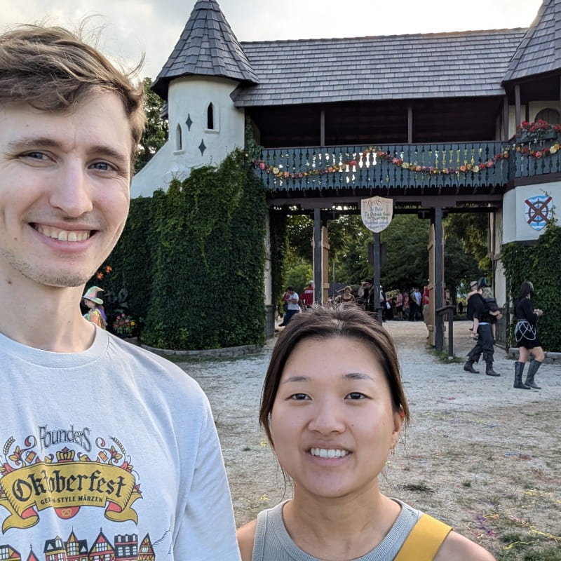 Cindy and Ian in front of a Medievel-looking building